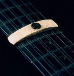 T-capo attached to instrument
