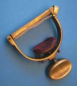 Bronze banjo capo.